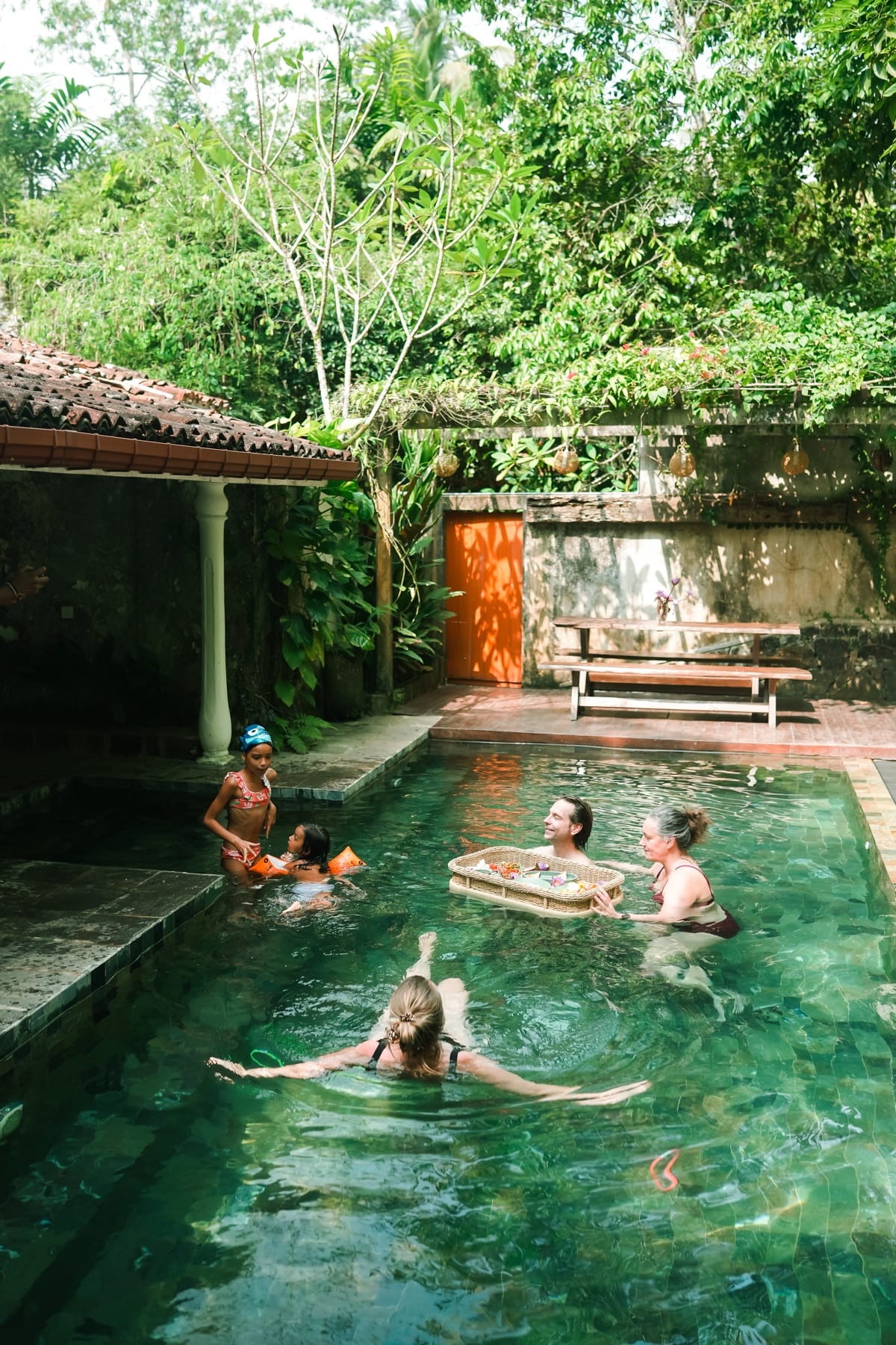 Stone plunge pool with guests